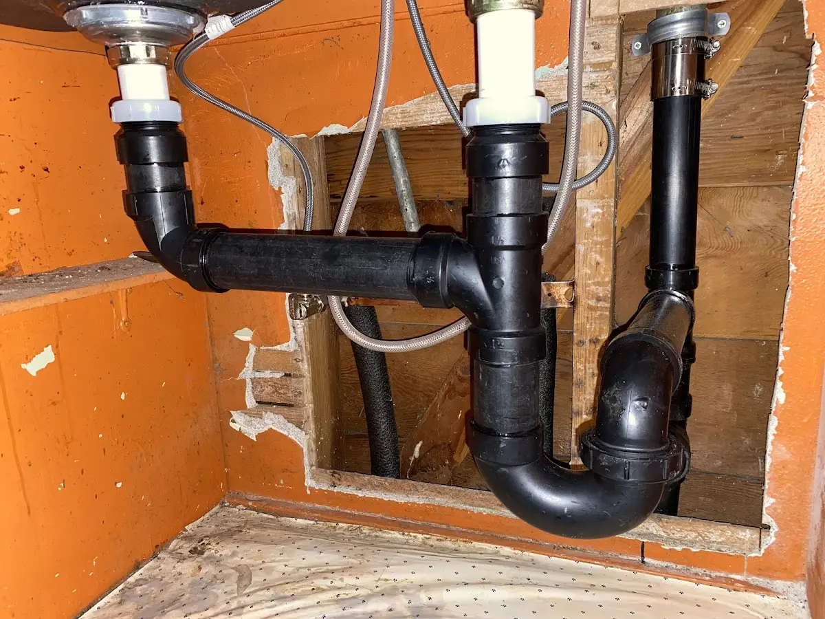 Professional Garbage Disposal Repair equipment and tools on the job in Wind Lake